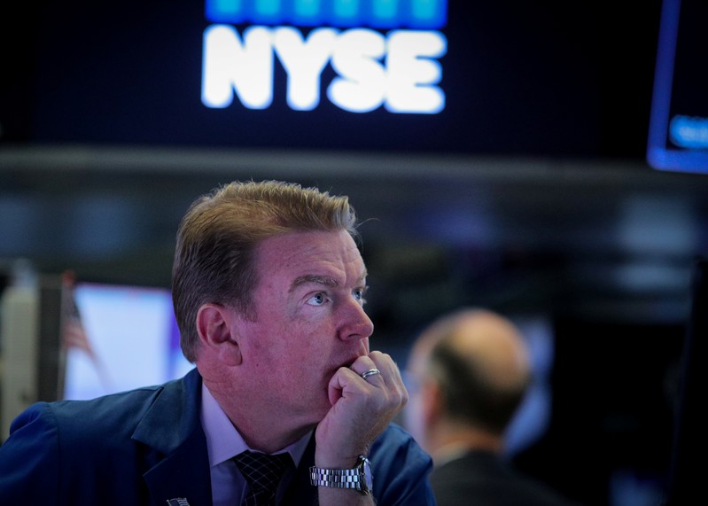 Traders work on the floor at the NYSE in New York