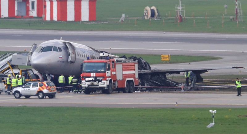FILE PHOTO: Members of emergency services work at the scene of an incident involving an Aeroflot Sukhoi Superjet 100 passenger plane at Moscow's Sheremetyevo airport