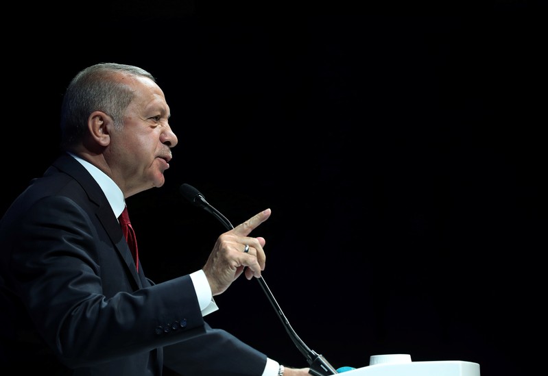 FILE PHOTO: Turkish President Erdogan addresses bussiness people during a meeting in Ankara