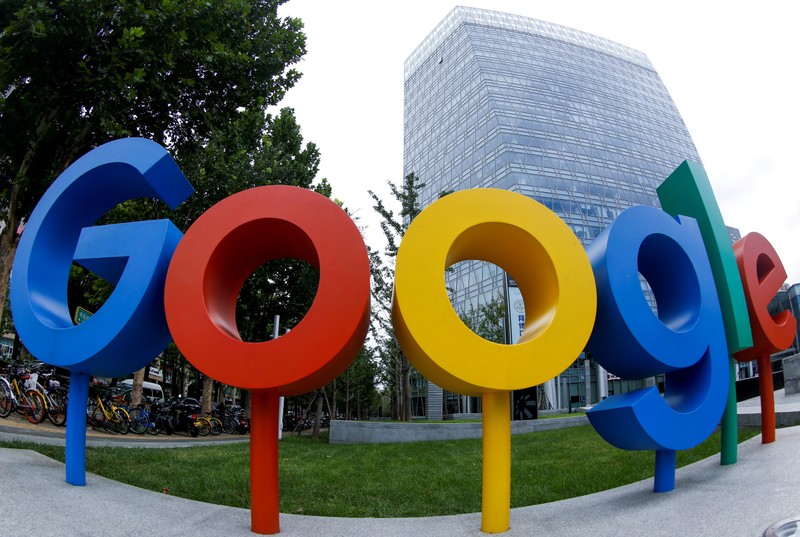 FILE PHOTO: The brand logo of Alphabet Inc's Google is seen outside its office in Beijing