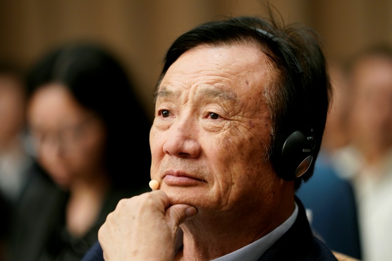 Huawei founder Ren Zhengfei attends a panel discussion at the company headquarters in Shenzhen