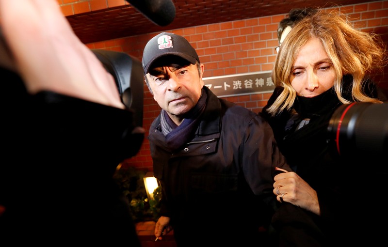 FILE PHOTO: Former Nissan Motor Chairman Carlos Ghosn and wife Carole Ghosn arrive at his place of residence in Tokyo