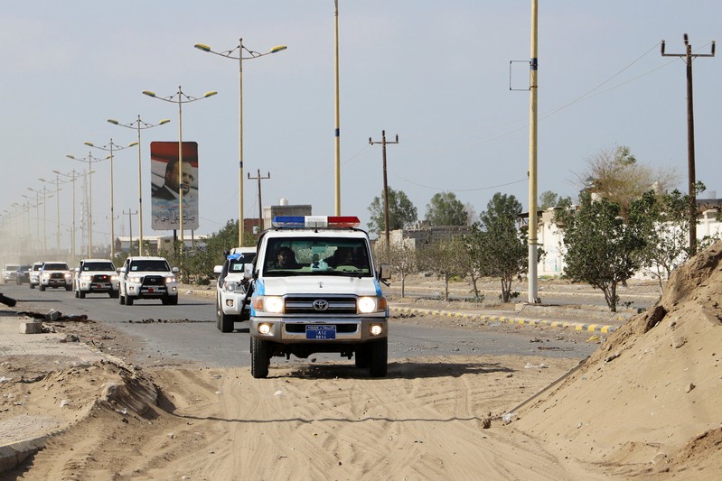 FILE PHOTO: The convoy of a team from the United Nations and the World Food Program crosses from Houthi-controlled areas to a government-controlled areas to reach grain mills in an eastern suburb of Hodeidah