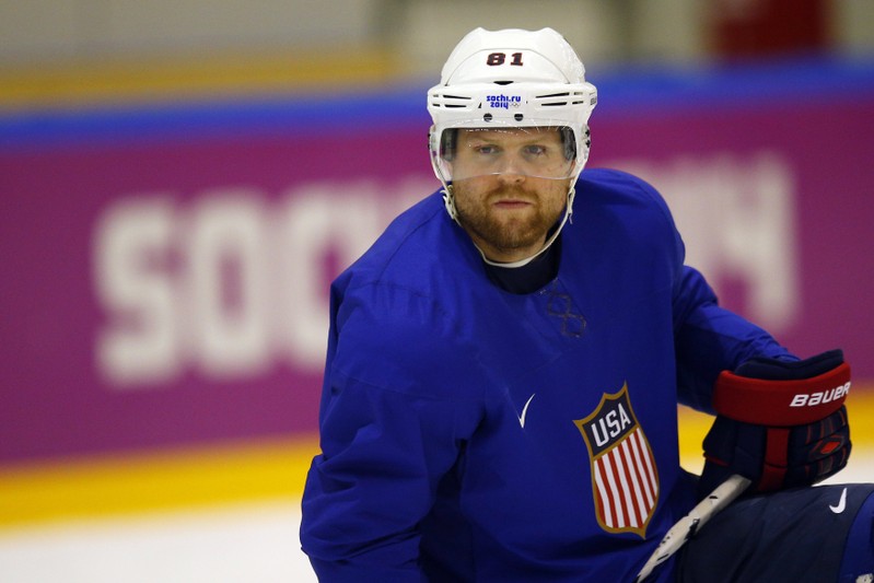Men's ice hockey player Kessel of the U.S. watches his teammates take shots during a team practice at the 2014 Sochi Winter Olympics