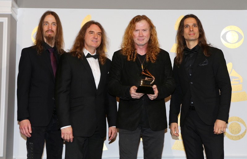 FILE PHOTO: Members of Megadeth hold the award for Best Metal Performance for