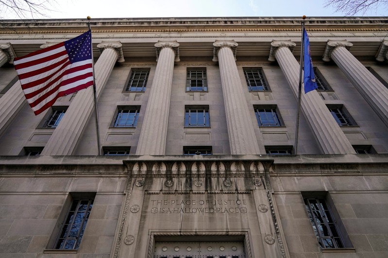 FILE PHOTO: A flag flies from the Department of Justice in Washington
