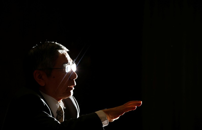 FILE PHOTO: Bank of Japan Governor Kuroda speaks during a group interview at the BOJ headquarters in Tokyo