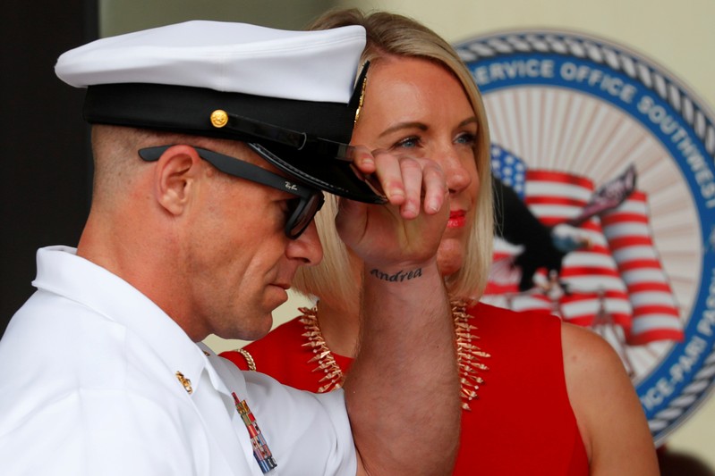 U.S. Navy SEAL Special Operations Chief Gallagher leaves court with his wife after the first day of jury selection at the court-martial trial at Naval Base San Diego
