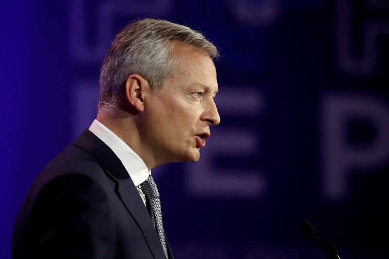 FILE PHOTO: French Economy and Finance Minister Bruno Le Maire delivers a speech during a high-level forum on debt at the Finance ministry in Paris