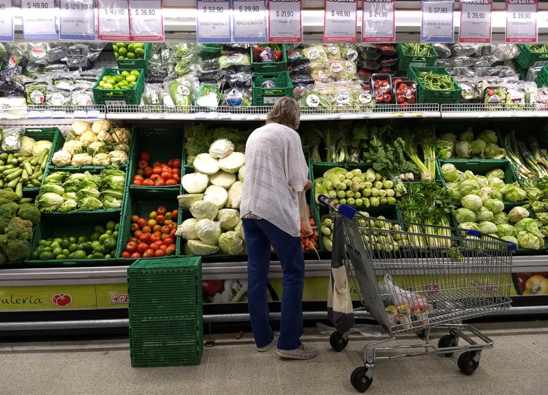 A woman shops in a supermarket in Buenos Aires