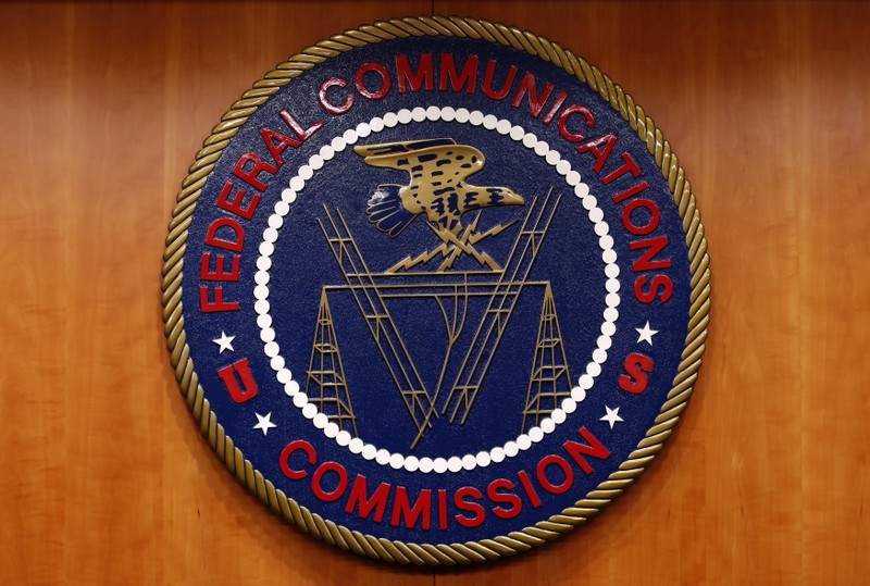 FILE PHOTO: The Federal Communications Commission (FCC) logo is seen before the FCC Net Neutrality hearing in Washington