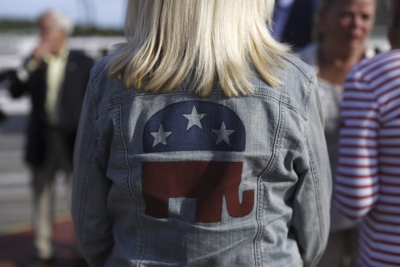 FILE PHOTO - A Republican supporter wears a party logo on her denim jacket before a sunset cruise with the Belknap County Republicans in Laconia