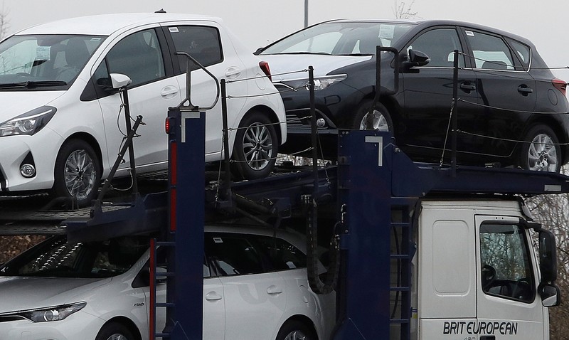 FILE PHOTO: New Toyota cars are transported from their manufacturing facility in Burnaston