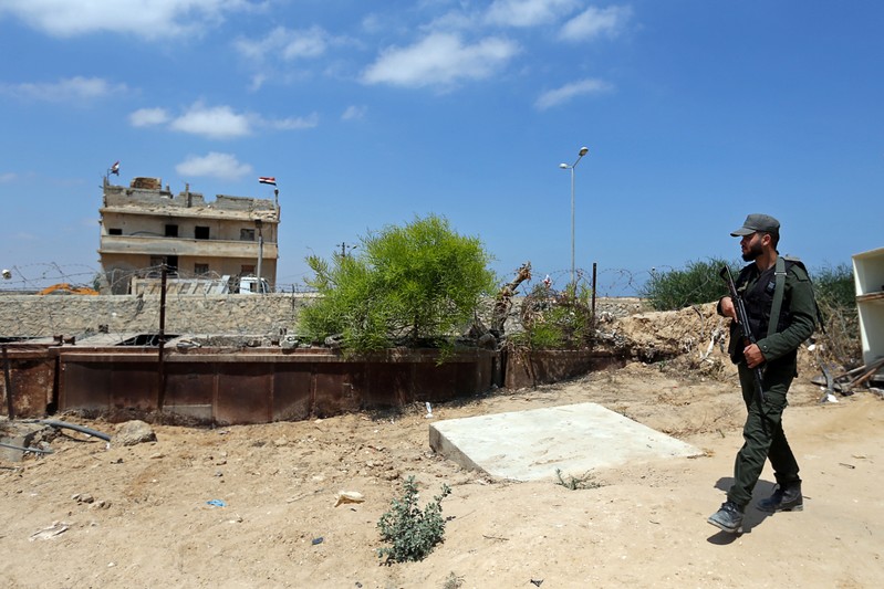 Member of Palestinian security forces loyal to Hamas patrols the border area with Egypt, in the southern Gaza Strip