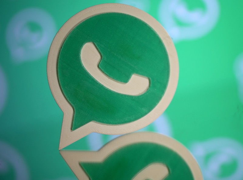 FILE PHOTO: A 3D printed Whatsapp logo is seen in front of a displayed Whatsapp logo in this illustration