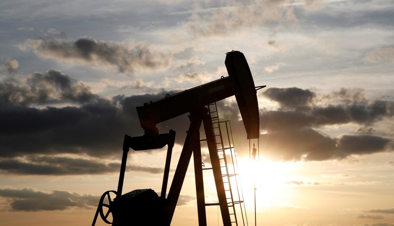 An oil pump is seen at sunset outside Vaudoy-en-Brie