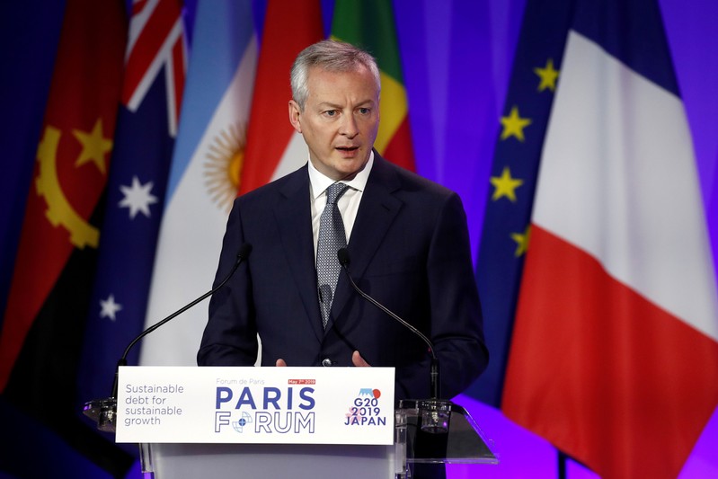 FILE PHOTO: French Economy and Finance Minister Bruno Le Maire delivers a speech during a high-level forum on debt at the Finance ministry in Paris