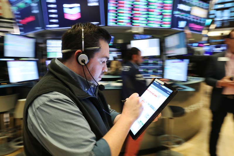 Traders work on the floor of the New York Stock Exchange shortly after the opening bell in New York