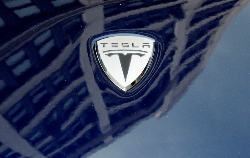 Tesla Motors on an electric car model is seen outside a showroom in New York