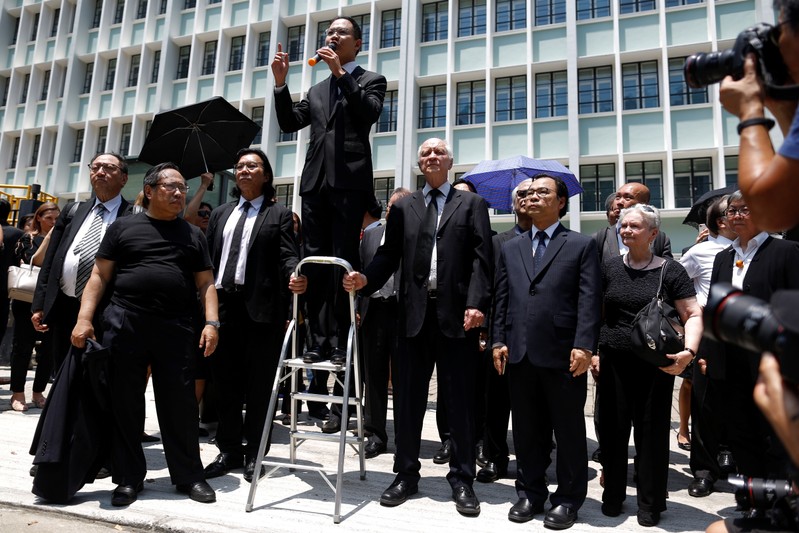 Lawyers and workers in Hong Kong's legal sector gather outside the Department of Justice during a protest in Hong Kong