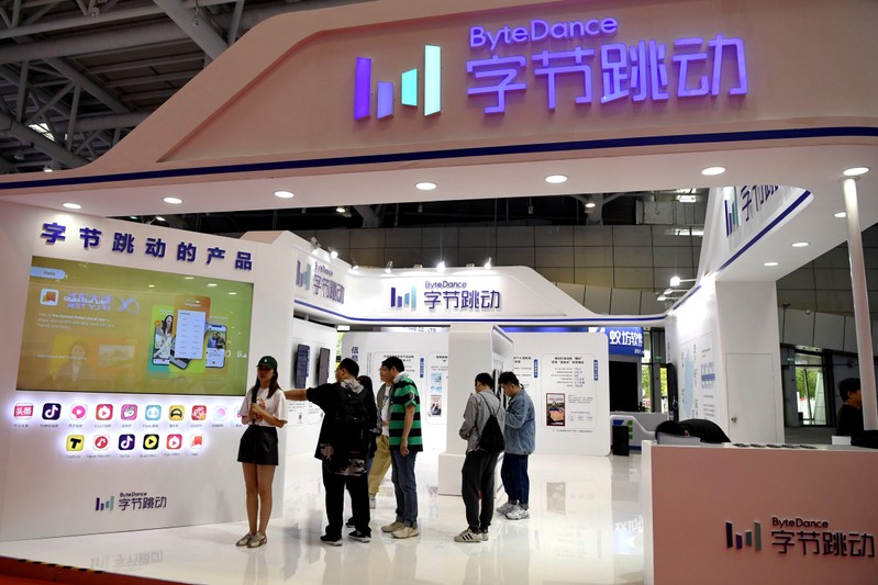 People are seen at the Bytedance Technology booth at the Digital China exhibition in Fuzhou, Fujian