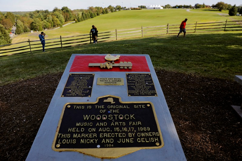 FILE PHOTO: A memorial stands above the original site of the Woodstock Music Festival while visiting to celebrate the 50th anniversary of the infamous Woodstock Music Festival in Bethel, New York