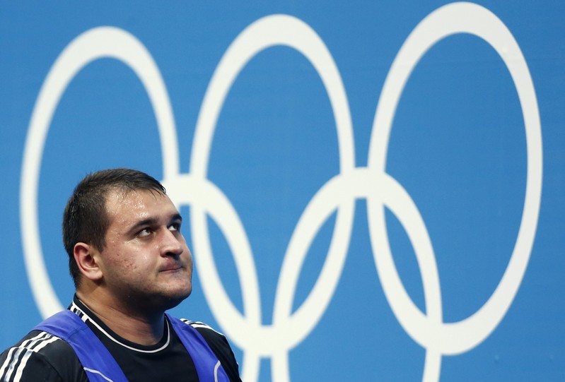 FILE PHOTO: Russia's Ruslan Albegov reacts after failing a lift attempt during the men's +105kg Group A clean and jerk weightlifting competition during the London 2012 Olympic Games
