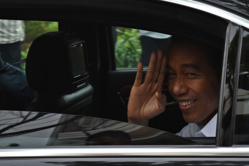 FILE PHOTO: Incumbent Indonesian president Joko Widodo leaves after a press briefing in Jakarta
