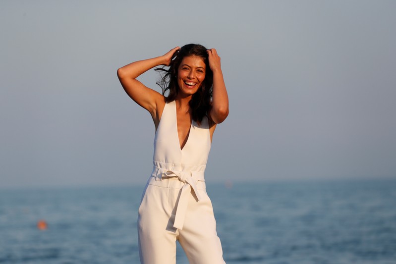 Italian actress Alessandra Mastronardi poses during a photocall on the beach
