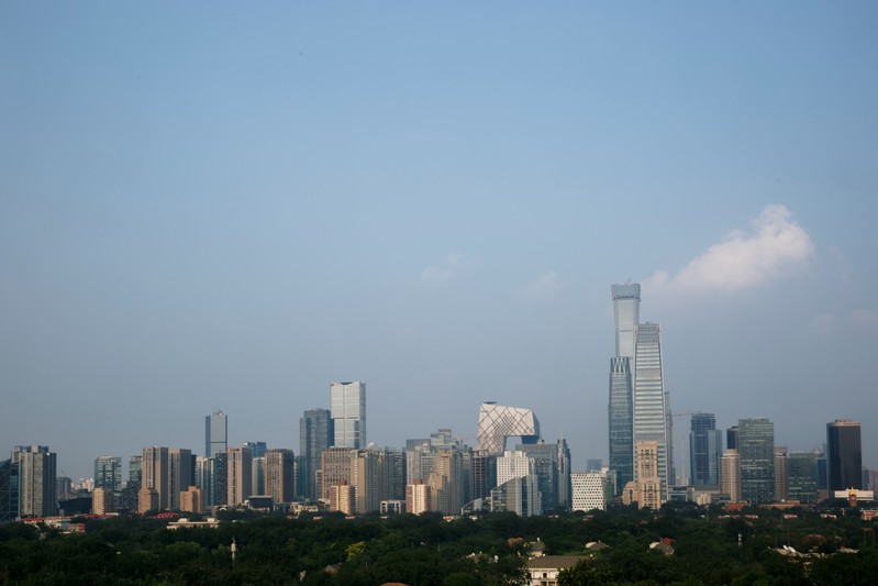 The skyscrapers of the Central Business District rise behind the capital's embassy neighbourhood in Beijing
