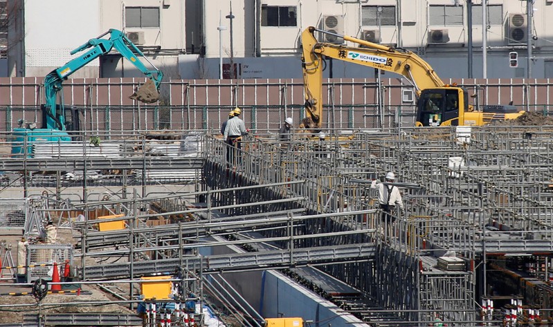 Power shovel machines are seen at a construction site in Tokyo