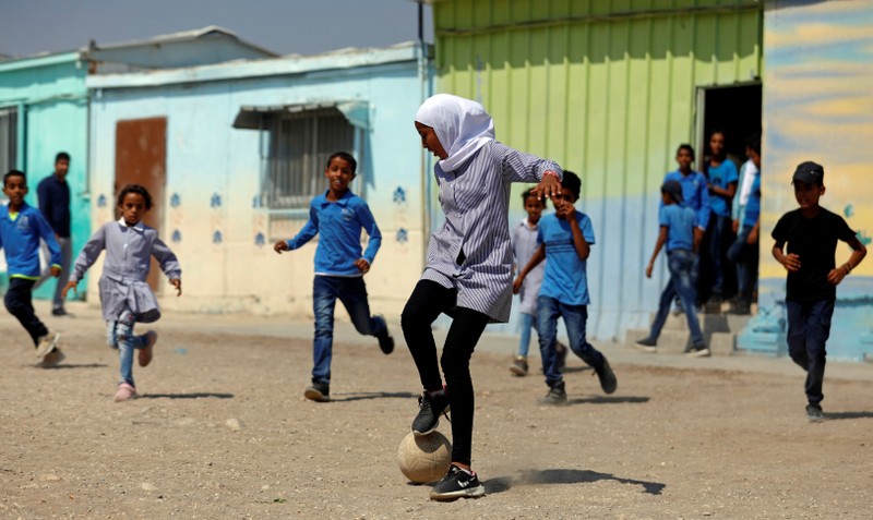 Palestinian students play soccer at their school in Jordan Valley in the Israeli-occupied West Bank