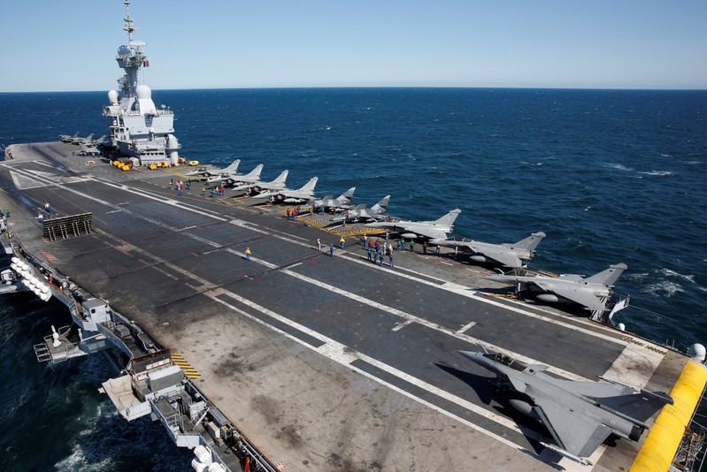 Etendards fighter jets are parked prior to a mission aboard France's Charles de Gaulle aircraft carrier sailing in the Gulf