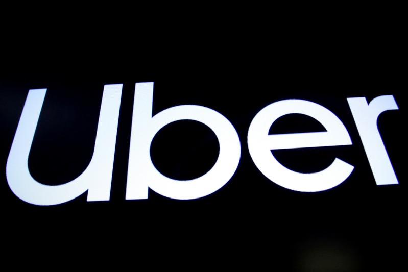 FILE PHOTO: A screen displays the company logo for Uber Technologies Inc. on the day of its IPO at the NYSE in New York