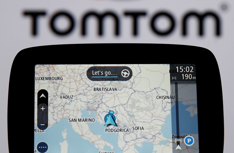 FILE PHOTO: TomTom navigation are seen in front of TomTom displayed logo in this illustration taken