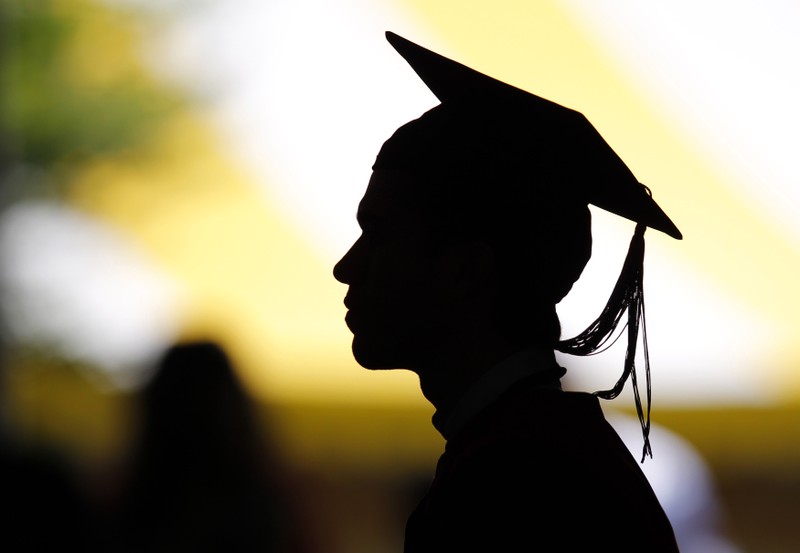 FILE PHOTO: Students take their seats for the diploma ceremony at Harvard University in Cambridge