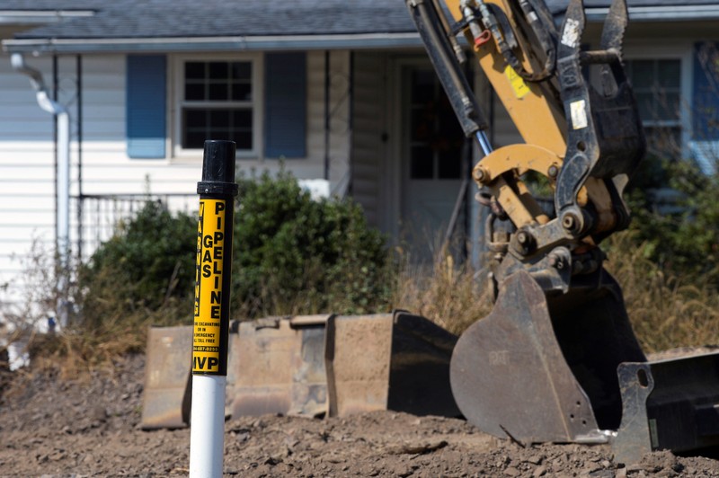 A warning sign for the Mountain Valley Pipeline in front of a home near Elliston