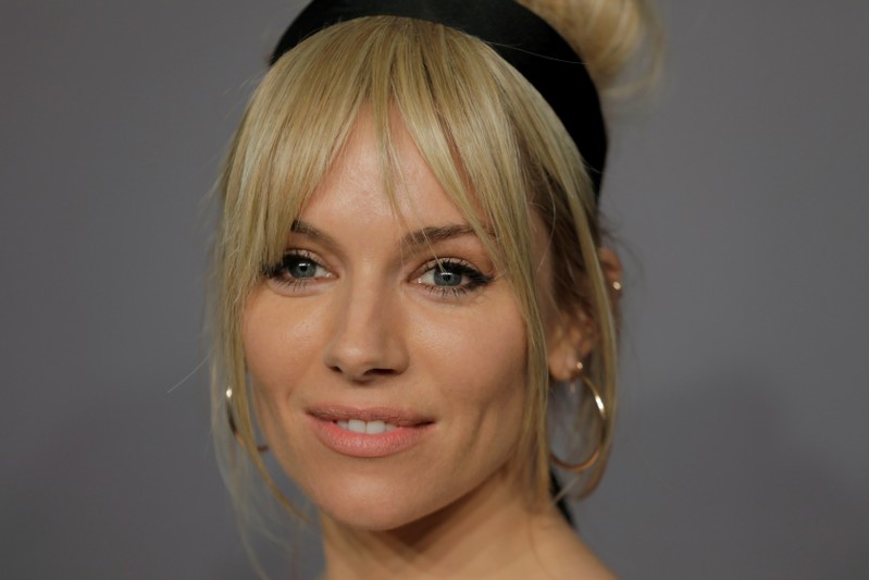 FILE PHOTO: Actor Sienna Miller arrives for an amfAR gala to celebrate Lee Daniels during New York Fashion Week in New York