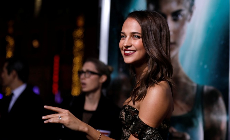 Cast member Vikander poses at the premiere for