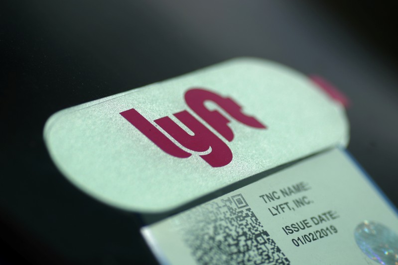 FILE PHOTO: A Lyft sticker is seen in a car windscreen in Los Angeles
