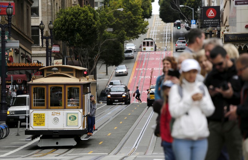 Passengers await a cable car near Union Square in San Francisco