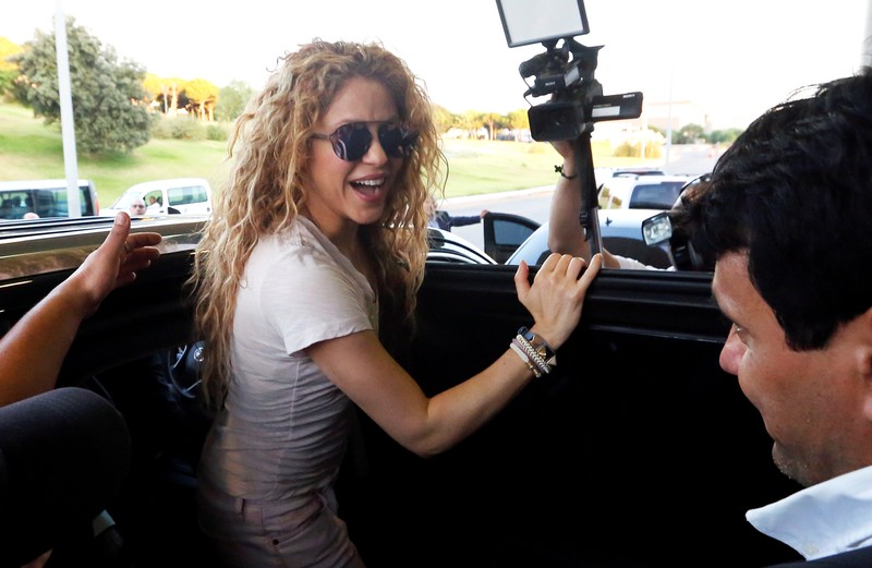 FILE PHOTO - Colombian singer Shakira reacts upon her arrival with her kids at the airport in Beirut