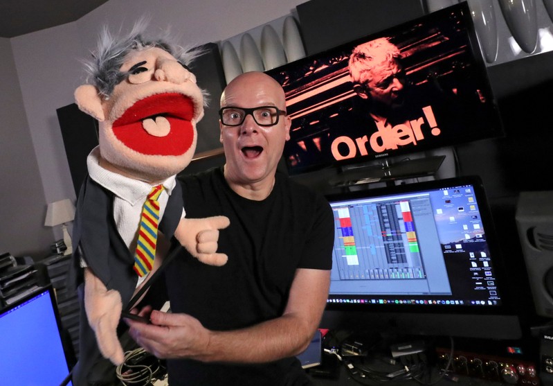 Belgian music producer Michael Schack poses with a puppet depicting John Bercow in Antwerp