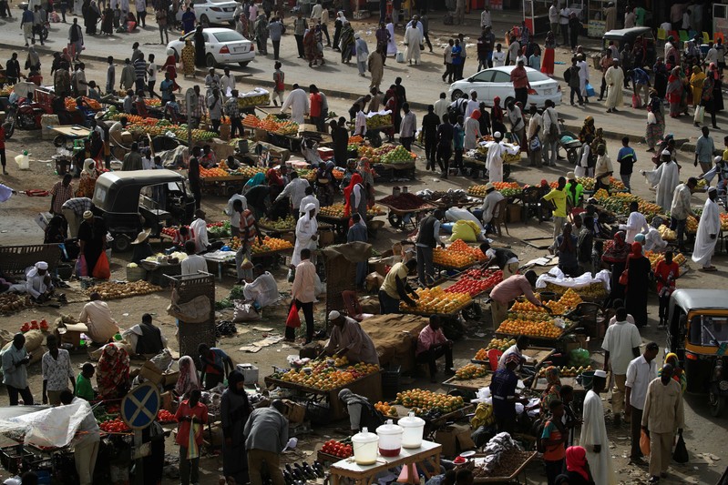 Sudanese residents shop in a bazaar in Khartoum
