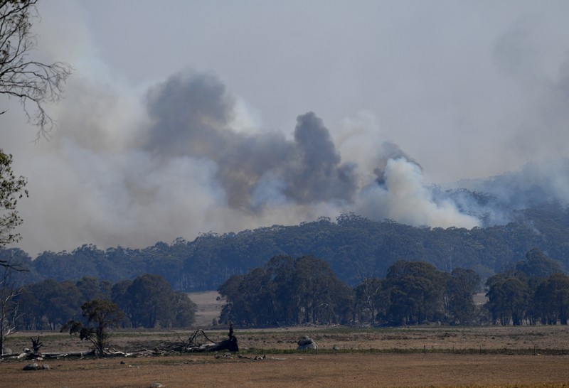 Smoke from a large bushfire is seen outside Wytaliba, near Glen Innes