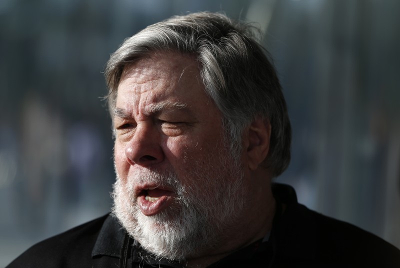 FILE PHOTO - Steve Wozniak, co-founder of Apple, talks to people during a launch event in Cupertino