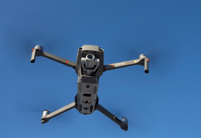 A drone is seen in the sky as Chinese drone maker DJI holds a demonstration to display an app that tracks a drone's registration and owner in Montreal