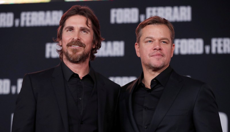 Cast members Bale and Damon pose at a special screening for the movie