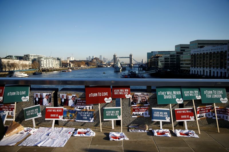Placards and tributes to victims are seen on London Bridge in London