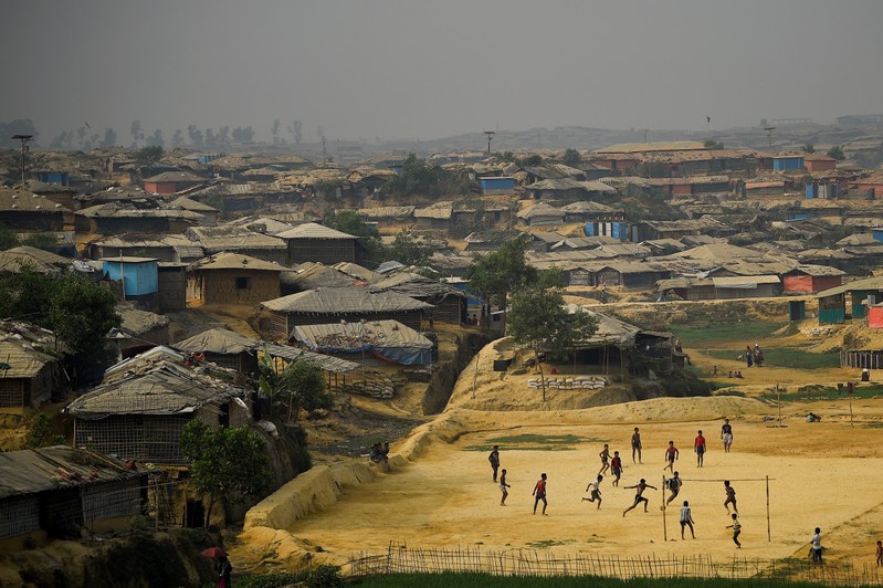 The Wider Image: Rohingya refugees fish in troubled waters